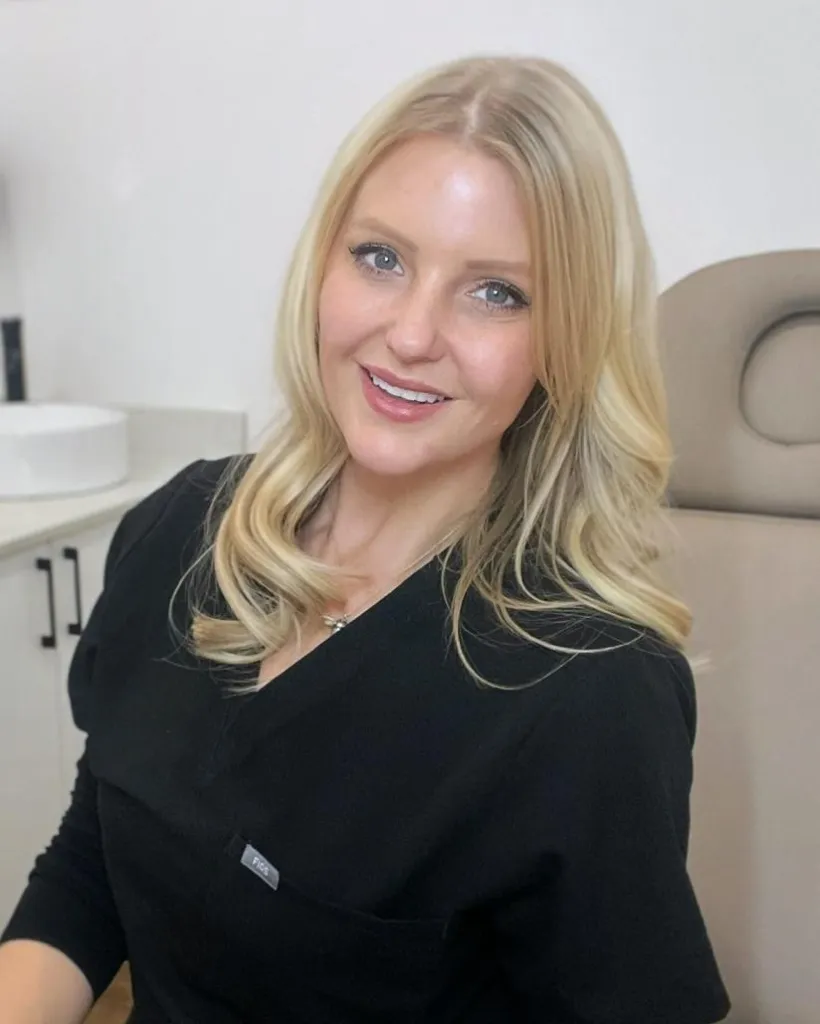 Hayley Ford sitting in her clinic room, smiling